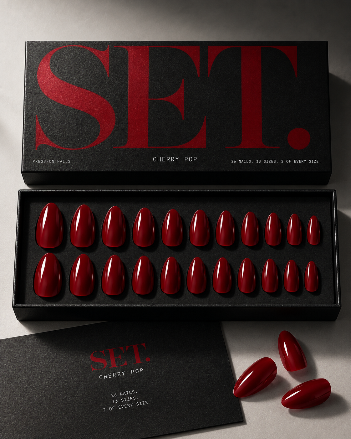 Black SET. box opened to show a full set of glossy almond press-on nails